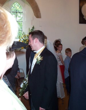 With the deed done, Greg shares a joke with a maiden aunt (obscured)